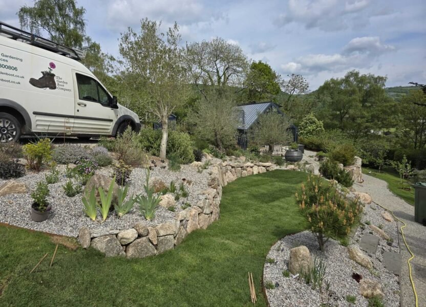 Van behind completed lawn