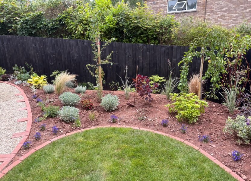 Flower bed at edge of garden